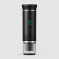 Tazzi portable espresso maker in matte black, front view, assembled with the ribbed clear cup attached