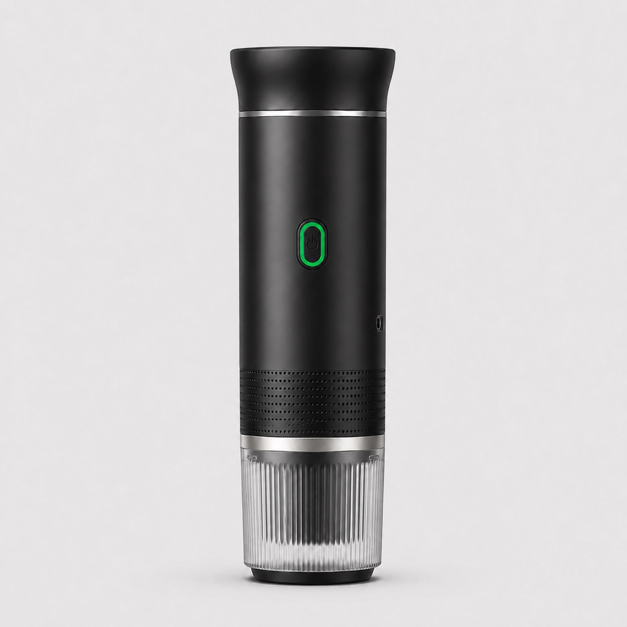 Tazzi portable espresso maker in matte black, front view, assembled with the ribbed clear cup attached