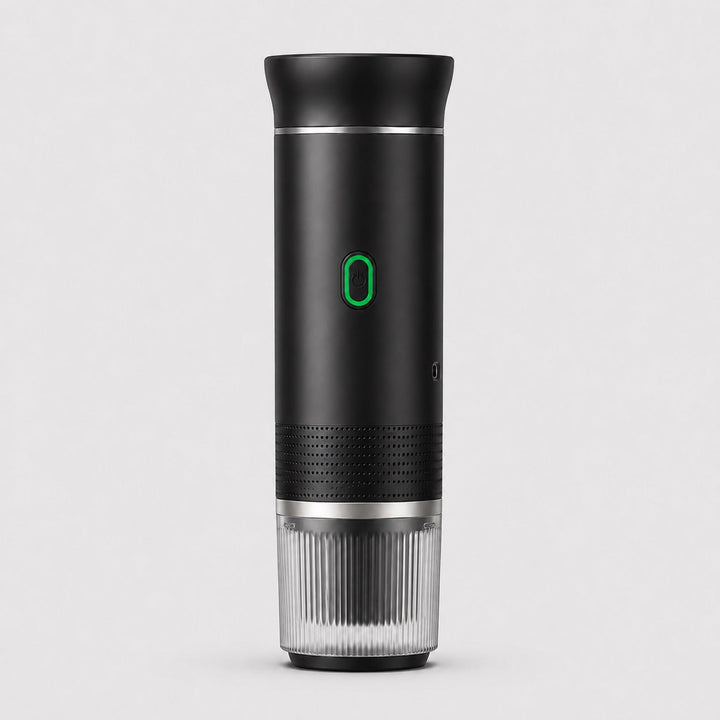 Tazzi portable espresso maker in matte black, front view, assembled with the ribbed clear cup attached