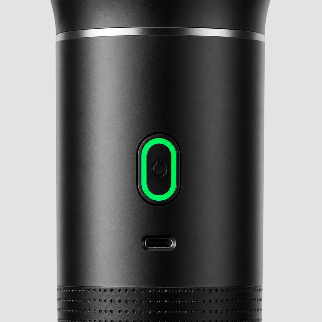 Close-up of the Tazzi single pill-shaped button with green LED ring and the USB-C charging port below it
