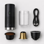 Tazzi components laid out from above: the black body, the ribbed clear cup, a USB-C cable and the three adapters